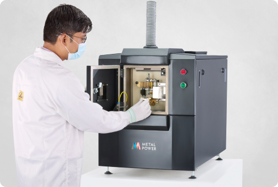 Technician operating Metal Power spectrometer for metal analysis in laboratory