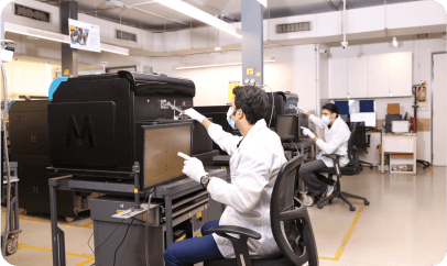 Engineers working on laboratory equipment